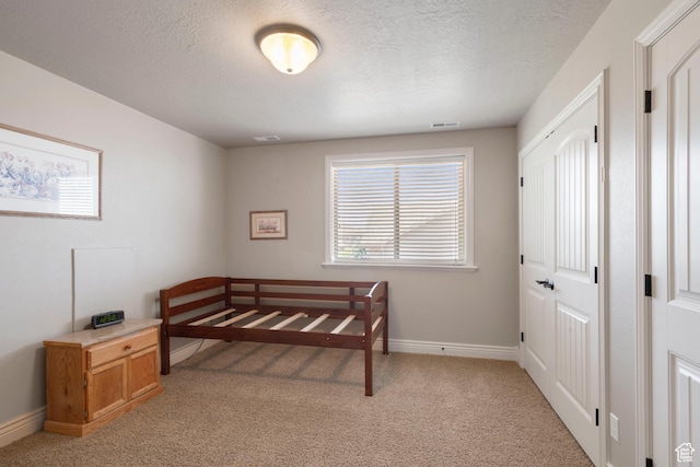 258 E Red Leaf Dr, Draper, UT 84020 - bedroom featuring light colored carpet and a textured ceiling
