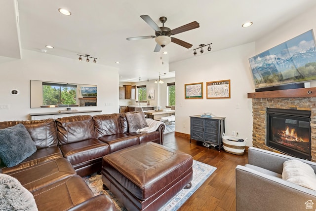 14275 N Buck Horn Trl Unit 41-F, Kamas, UT 84036 - living area with track lighting, ceiling fan, wood-type flooring, recessed lighting, and a stone fireplace