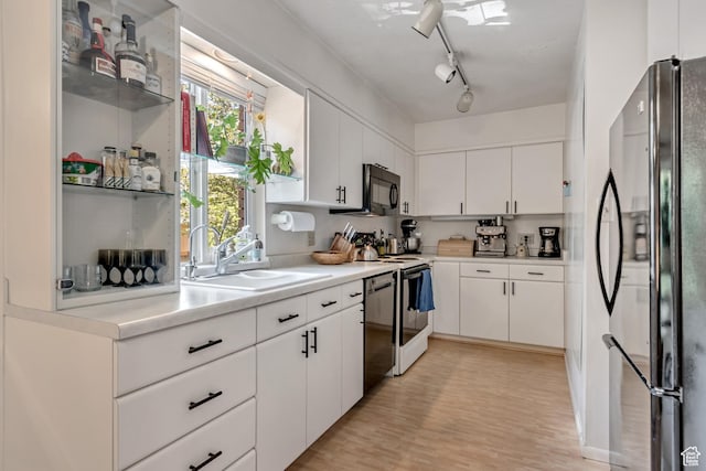 4797 S 2124 E, Holladay, UT 84117 - kitchen with freestanding refrigerator, electric stove, black microwave, white cabinets, and dishwasher