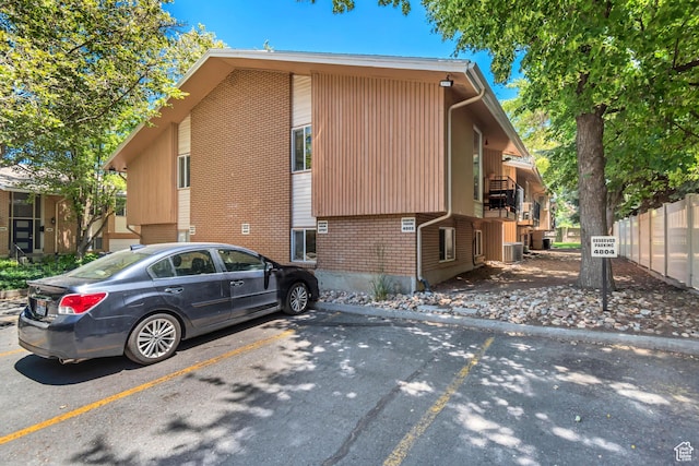 4797 S 2124 E, Holladay, UT 84117 - view of property exterior with brick siding and uncovered parking
