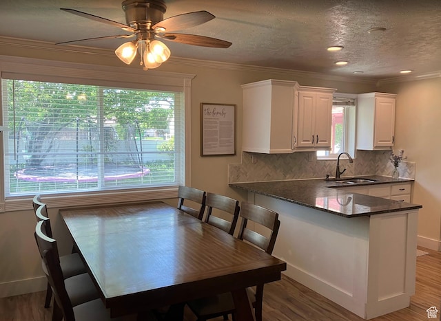 12900 S 2200 W, Riverton, UT 84065 - dining space with crown molding, ceiling fan, wood finished floors, and a textured ceiling