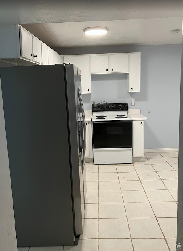 12900 S 2200 W, Riverton, UT 84065 - kitchen with stainless steel refrigerator with ice dispenser, electric range, light tile patterned floors, and light countertops