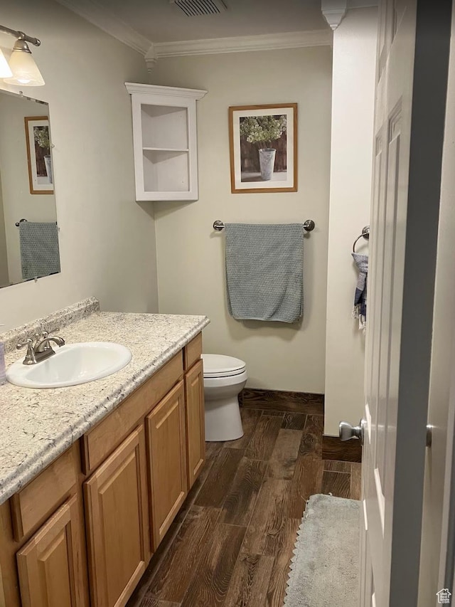12900 S 2200 W, Riverton, UT 84065 - bathroom with wood finished floors, vanity, and ornamental molding