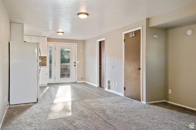 3638 Oldham Cir, West Valley City, UT 84120 - entrance foyer featuring baseboards and light carpet