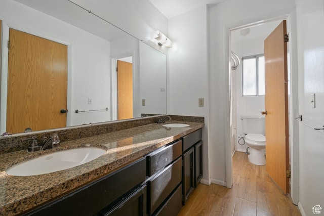 3638 Oldham Cir, West Valley City, UT 84120 - bathroom featuring wood finished floors and double vanity