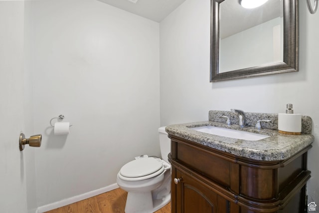 3638 Oldham Cir, West Valley City, UT 84120 - half bathroom featuring vanity and wood finished floors