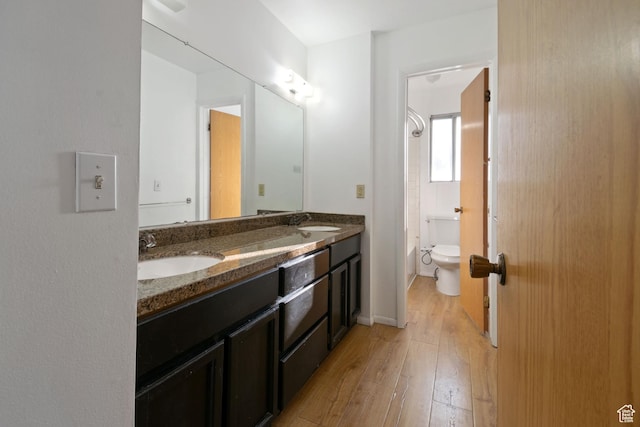 3638 Oldham Cir, West Valley City, UT 84120 - full bathroom featuring hardwood / wood-style floors, double vanity, and shower / tub combination