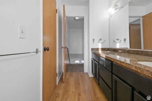 3638 Oldham Cir, West Valley City, UT 84120 - full bathroom with wood finished floors and double vanity
