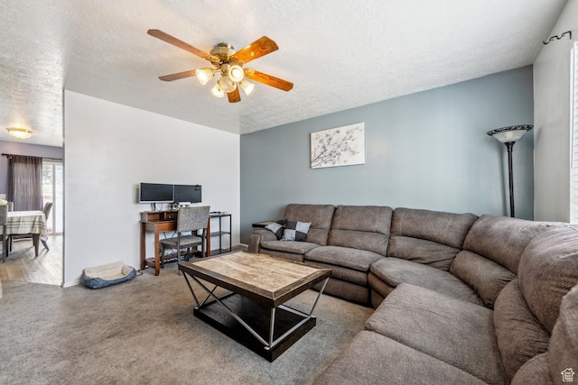 615 W 1080 S, Tooele, UT 84074 - carpeted living area with a textured ceiling and ceiling fan