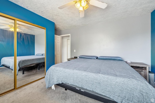 615 W 1080 S, Tooele, UT 84074 - bedroom featuring carpet, a textured ceiling, a closet, and a ceiling fan