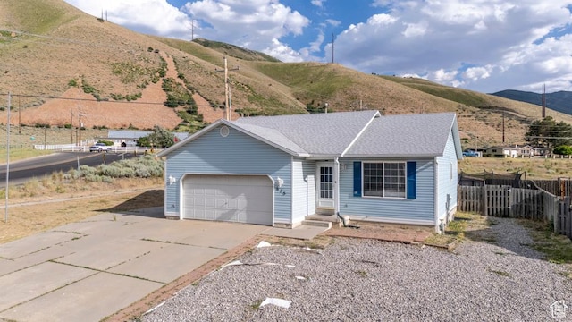615 W 1080 S, Tooele, UT 84074 - single story home with driveway, an attached garage, and a mountain view