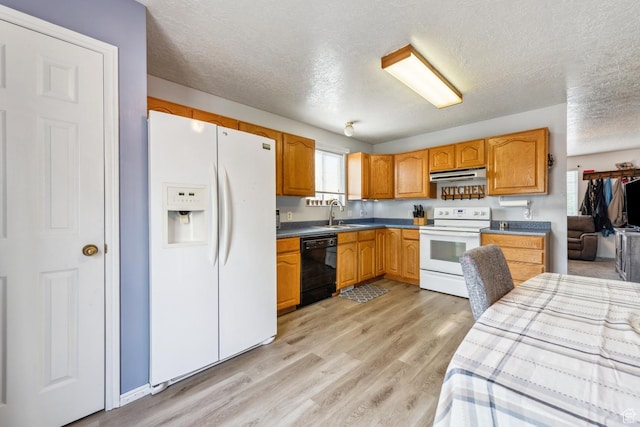 615 W 1080 S, Tooele, UT 84074 - kitchen featuring white appliances, ventilation hood, a textured ceiling, light wood-style floors, and dark countertops