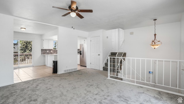 607 N 2000 W, West Point, UT 84015 - spare room featuring a ceiling fan, light carpet, and light tile patterned flooring