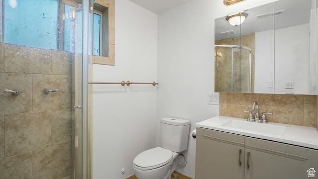 607 N 2000 W, West Point, UT 84015 - full bathroom featuring vanity, a shower stall, and tasteful backsplash