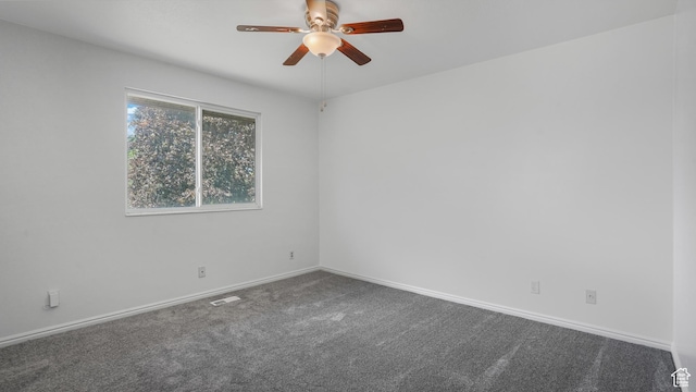 607 N 2000 W, West Point, UT 84015 - spare room with a ceiling fan and dark colored carpet