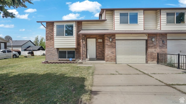 607 N 2000 W, West Point, UT 84015 - view of front of property with concrete driveway, brick siding, and an attached garage