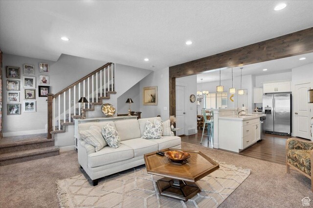 5538 N Turin Ln, Highland, UT 84003 - living area with carpet floors, stairs, and recessed lighting