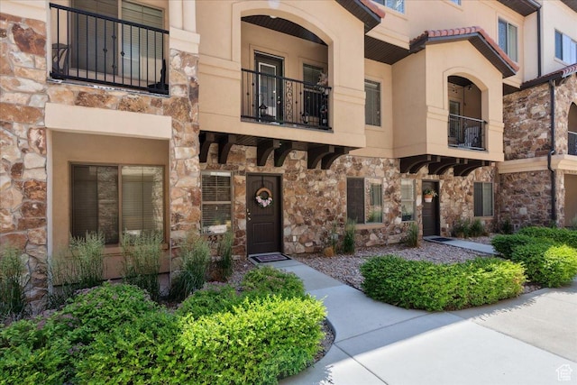 5538 N Turin Ln, Highland, UT 84003 - entrance to property with stone siding, a balcony, and stucco siding