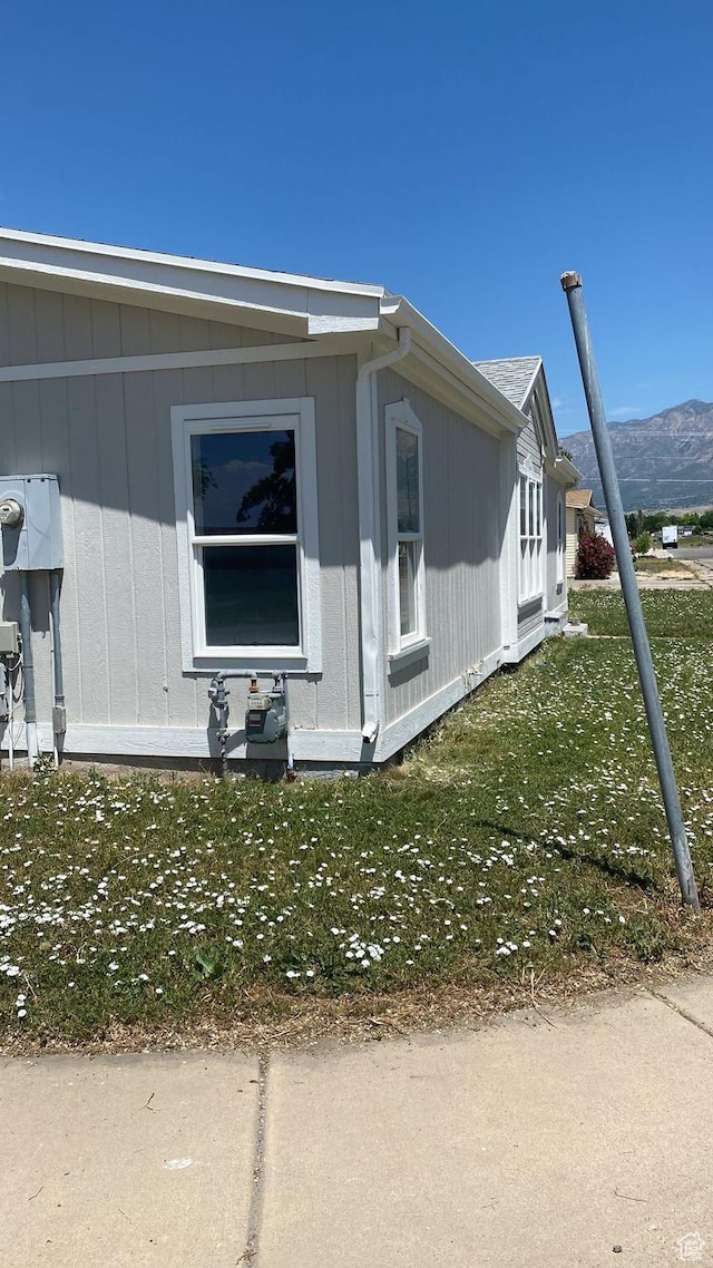 371 Broadmoor Ave, Ogden, UT 84404 - view of property exterior featuring a lawn and a mountain view