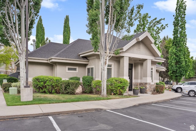 1205 E Privet Dr S Unit 101, Cottonwood Heights, UT 84121 - view of building exterior with uncovered parking