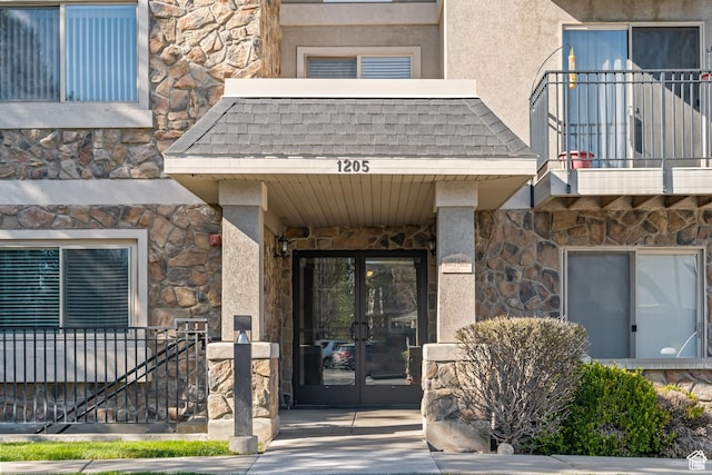 1205 E Privet Dr S Unit 101, Cottonwood Heights, UT 84121 - doorway to property with stone siding, french doors, a balcony, and stucco siding