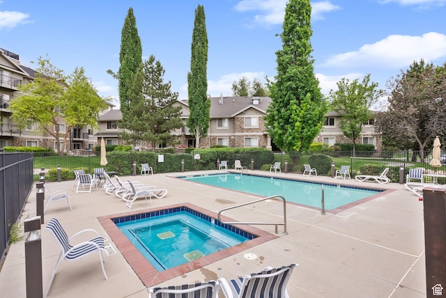 1205 E Privet Dr S Unit 101, Cottonwood Heights, UT 84121 - community pool featuring a hot tub, a patio area, and a residential view