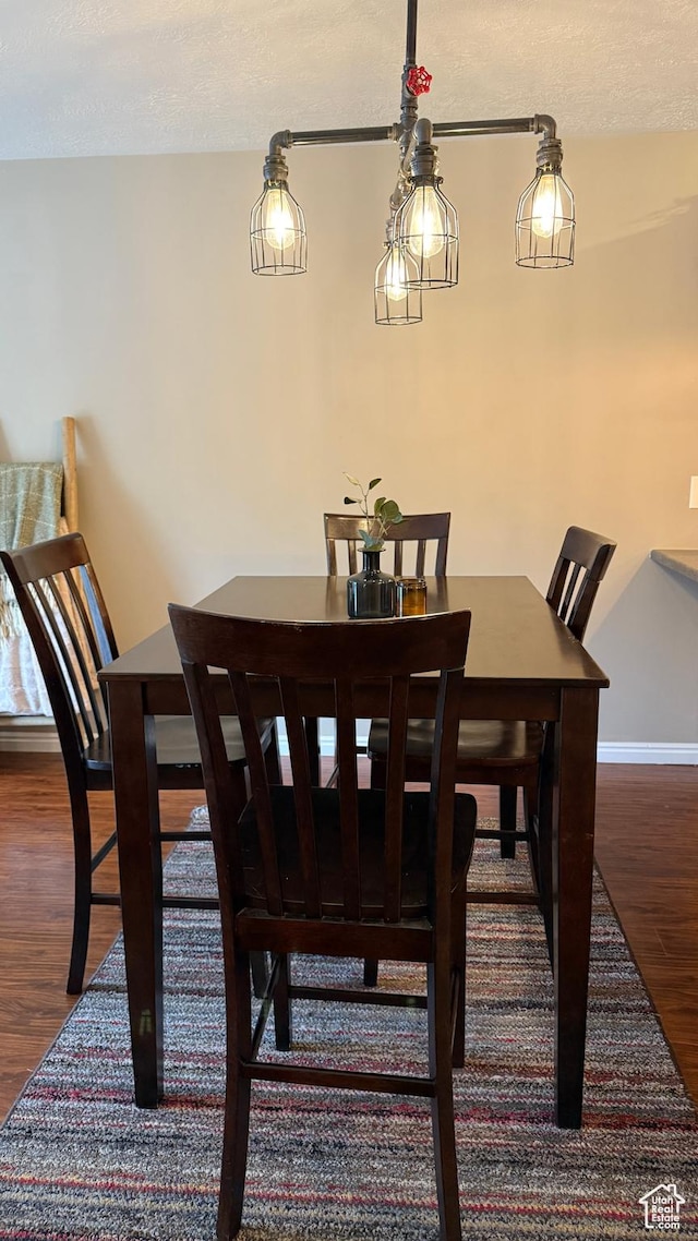 1205 E Privet Dr S Unit 101, Cottonwood Heights, UT 84121 - dining room featuring wood finished floors and a textured ceiling