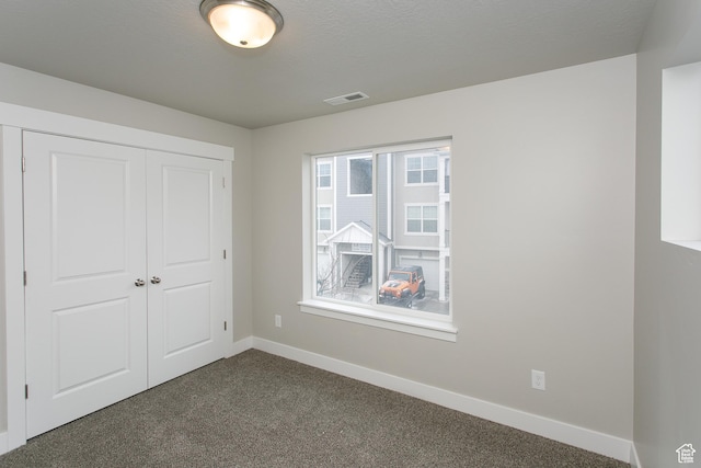 5001 W Anegada Ln S, Herriman, UT 84096 - unfurnished bedroom with dark carpet and a closet