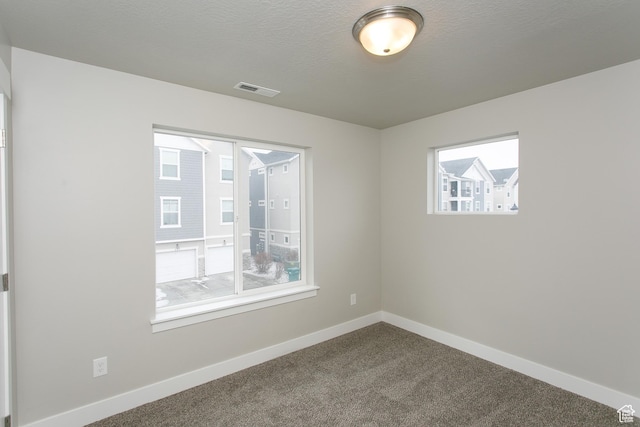 5001 W Anegada Ln S, Herriman, UT 84096 - unfurnished room with baseboards and dark carpet