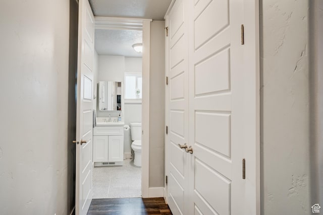 768 E 800 S, Salt Lake City, UT 84102 - bathroom with a textured ceiling, vanity, and wood finished floors