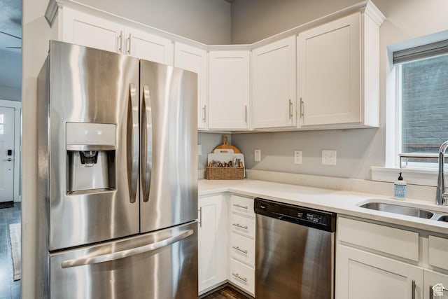 768 E 800 S, Salt Lake City, UT 84102 - kitchen featuring appliances with stainless steel finishes, white cabinetry, and light countertops