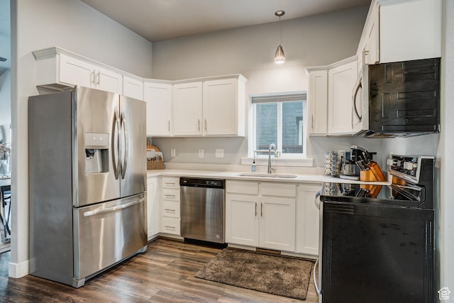 768 E 800 S, Salt Lake City, UT 84102 - kitchen with appliances with stainless steel finishes, dark wood-type flooring, white cabinets, and light countertops
