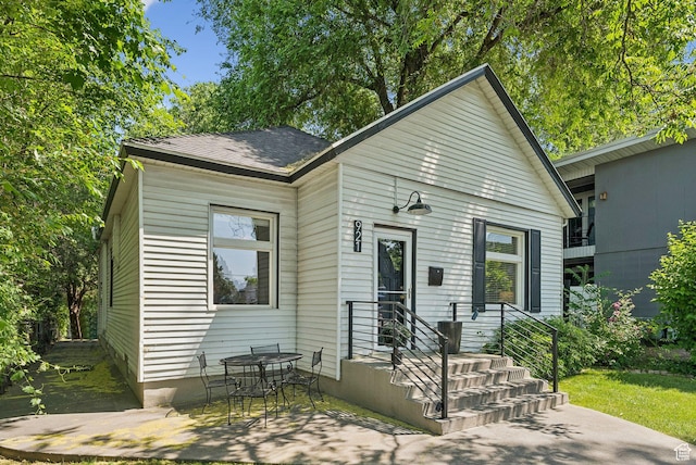 921 E 800 S, Salt Lake City, UT 84102 - view of front facade with a patio and roof with shingles