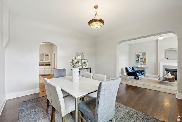 921 E 800 S, Salt Lake City, UT 84102 - dining room with arched walkways, wood finished floors, and a ceiling fan