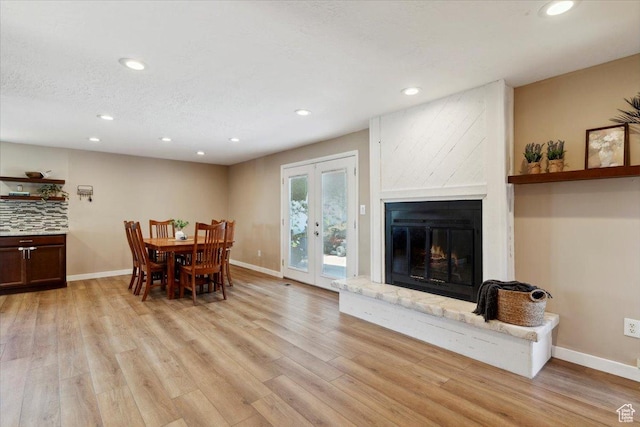 1260 E 2925 N, North Ogden, UT 84414 - dining area featuring recessed lighting, light wood finished floors, a fireplace, and french doors