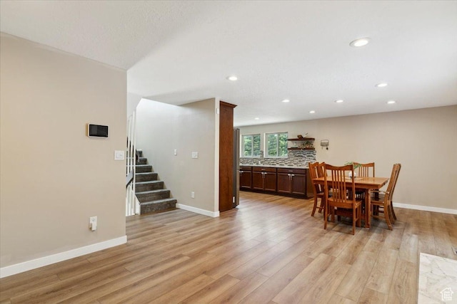 1260 E 2925 N, North Ogden, UT 84414 - dining area with light wood finished floors, recessed lighting, and stairs