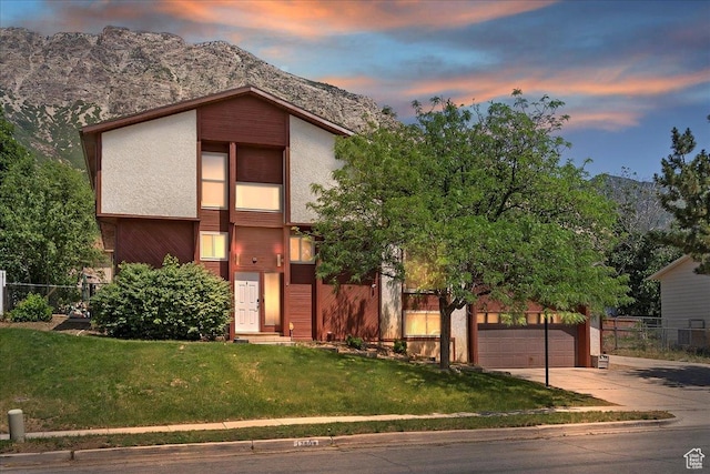 1260 E 2925 N, North Ogden, UT 84414 - mid-century home with driveway, a garage, stucco siding, and a mountain view