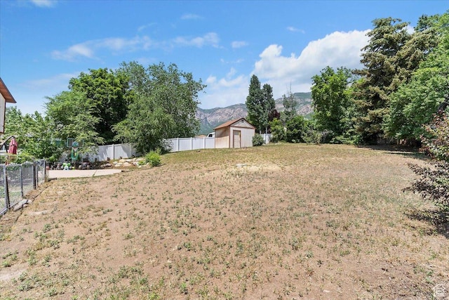 1260 E 2925 N, North Ogden, UT 84414 - view of yard featuring a mountain view and a storage shed