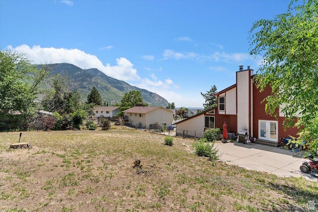 1260 E 2925 N, North Ogden, UT 84414 - view of yard with french doors, a mountain view, and a patio