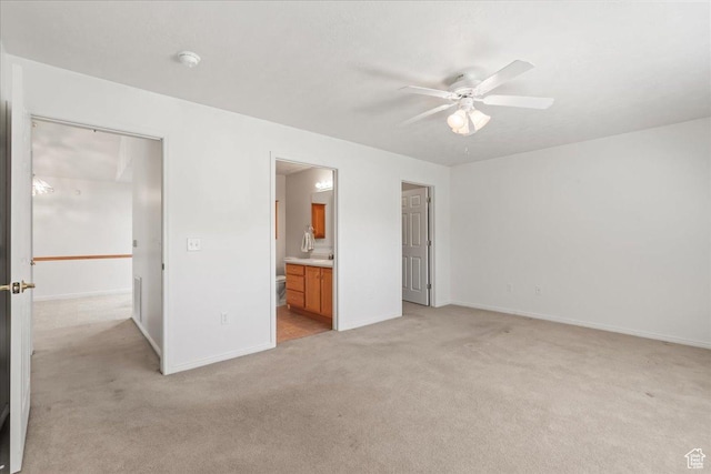 3304 S Hunter Villa Ln Unit D, West Valley City, UT 84128 - unfurnished bedroom featuring light colored carpet, connected bathroom, and ceiling fan