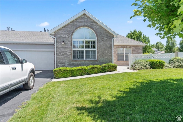 3304 S Hunter Villa Ln Unit D, West Valley City, UT 84128 - ranch-style house with brick siding, a garage, and asphalt driveway