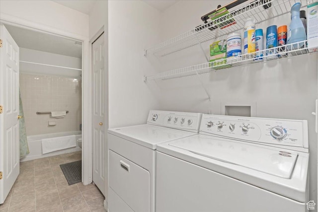 3304 S Hunter Villa Ln Unit D, West Valley City, UT 84128 - washroom with independent washer and dryer and light tile patterned flooring