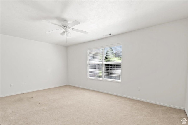 3304 S Hunter Villa Ln Unit D, West Valley City, UT 84128 - empty room featuring light carpet and ceiling fan