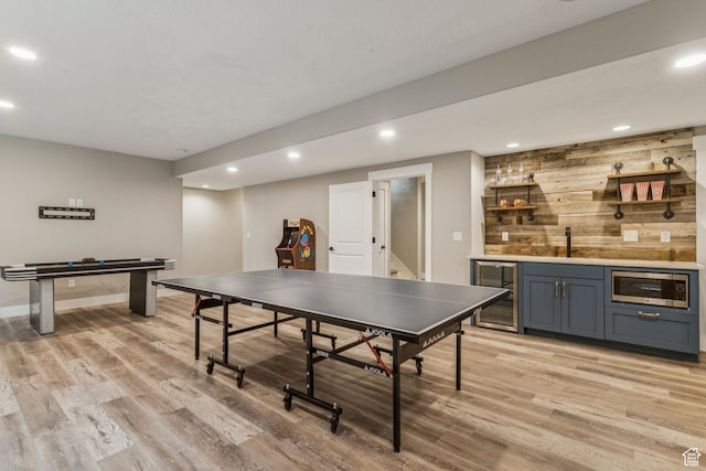 1652 E Red Tree Ct S, Draper, UT 84020 - game room featuring wine cooler, wet bar, light wood-type flooring, recessed lighting, and wooden walls