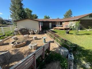 395 E Center St, Spring City, UT 84662 - back of house featuring a vegetable garden and a yard