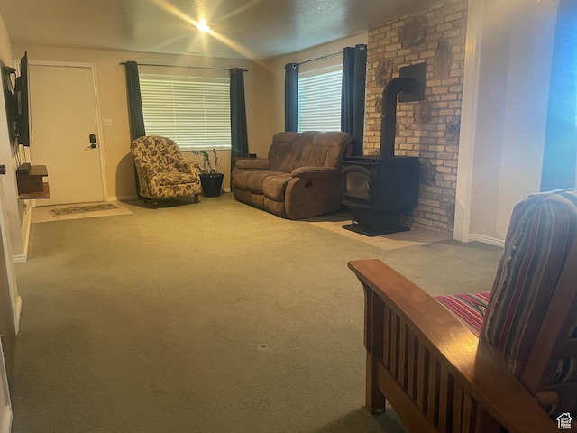 395 E Center St, Spring City, UT 84662 - carpeted living area featuring a wood stove and baseboards