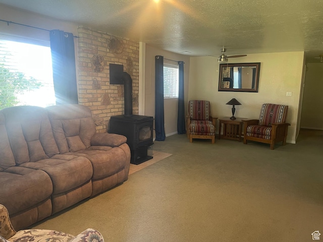 395 E Center St, Spring City, UT 84662 - carpeted living area with a textured ceiling, ceiling fan, and a wood stove