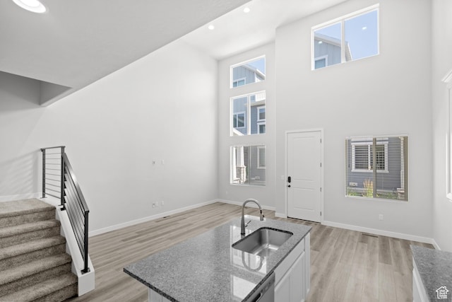 15040 S Wild Horse Way, Bluffdale, UT 84065 - foyer with stairway, light wood-type flooring, a towering ceiling, and recessed lighting