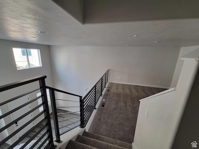 15040 S Wild Horse Way, Bluffdale, UT 84065 - staircase featuring a textured ceiling and carpet