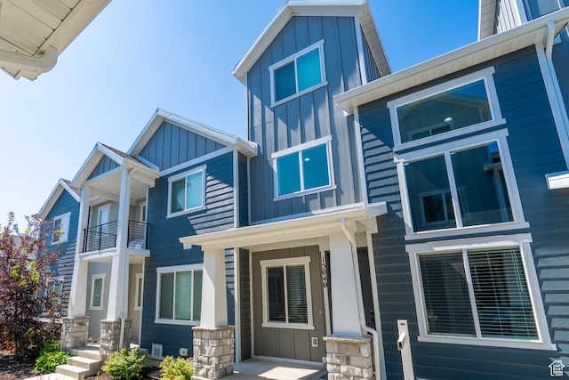 15040 S Wild Horse Way, Bluffdale, UT 84065 - view of front facade with board and batten siding and a balcony